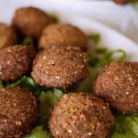 Falafel · Chickpeas and fava bean fritters with tahini sauce.