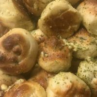 Giant Garlic Knots · A classic snack, our garlic knots are strips of pizza dough tied in a knot, baked, and then ...