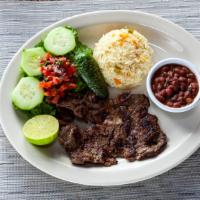 Carne Asada / Grilled Skirt Steak · Served with rice, salad and black beans.