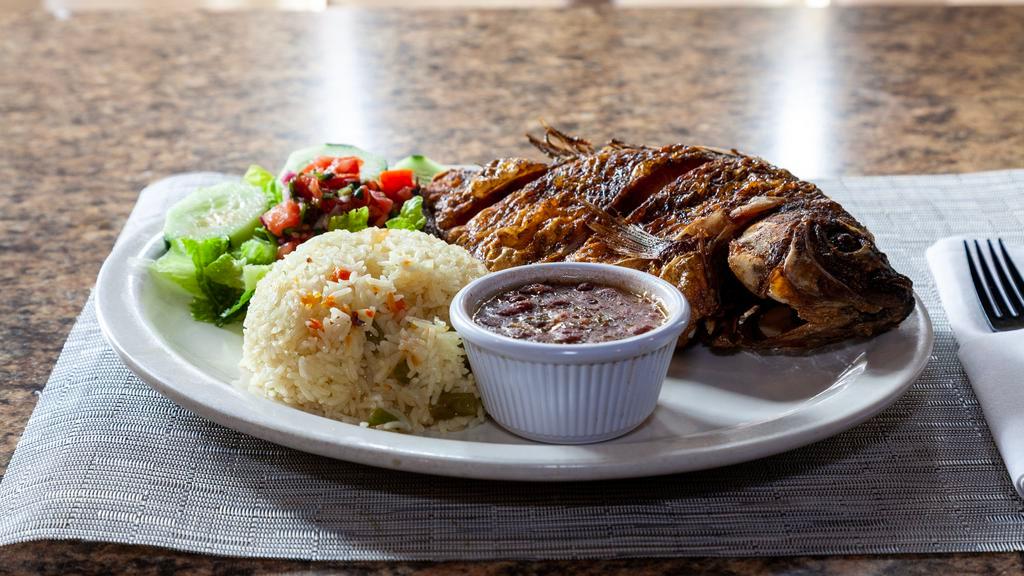 Pescado Frito / Fried Fish · Served with salad and rice.