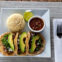 Tacos Al Carbon / Grilled Tacos · Rolled on three soft tortillas, topped with cilantro, pico de gallo, rice and black beans.