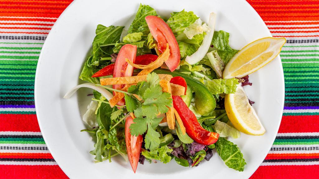 House Salad · Mixed greens, grilled peppers & onions, pico de gallo garlic bread and choice of dressing.