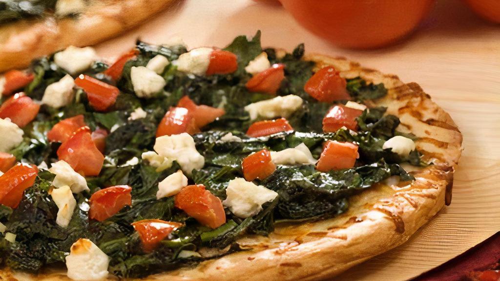 Greek Style Pizza · Mozzarella cheese, feta, spinach, tomatoes, olive oil, garlic.