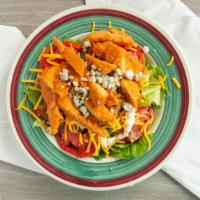 Buffalo Chicken Salad · spicy chicken strips over romaine lettuce with tomato, cucumber, crumbled blue cheese, bacon...