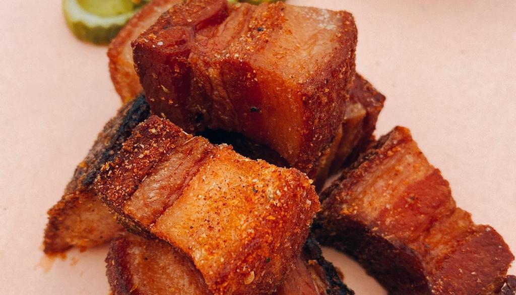 Chicharones De Carne (Crispy Pork Belly) · smoked and fried with crispy skin tossed in our bbq dry rub