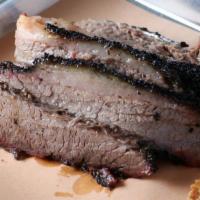 Beef Brisket* · Dry rubbed and smoked over oak wood. served sliced moist(fatty), lean or burnt ends.