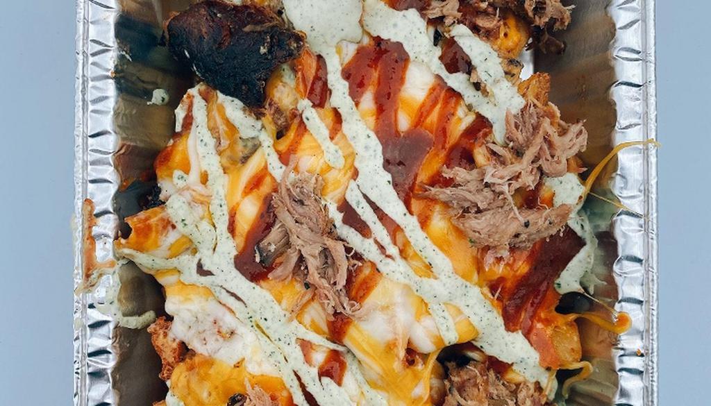 Loaded Fries · seasoned fries topped with pulled pork, melted cheese, bbq sauce, ranch