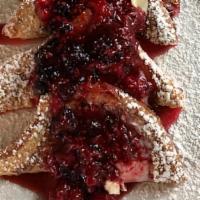 Stuffed French Toast · Egg battered toast, grilled and baked, stuffed with wild berries, strawberries or bananas an...