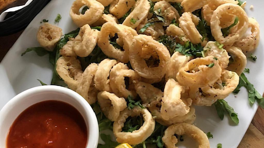 Fried Calamari  · Served with spicy marinara sauce and lemon wedge.