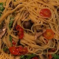 Capellini · “Angel hair pasta” wild mushrooms, arugula, cherry tomatoes, garlic, olive oil and white wine.