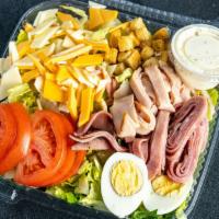 Chef Salad · Romaine lettuce, ham, turkey, American and provolone cheese, tomatoes, croutons and boiled e...