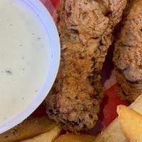 Kids Chicken Tenders · Two chicken tenders served with ranch dressing and fries.