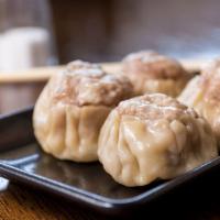 Pork Shumai (4 Pieces) · Steamed shumai dumplings.