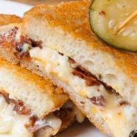 Favorite · Parmesan-crusted sourdough, american, cheddar, and gruyere cheese, crumbled bacon, and dijon...