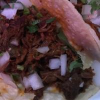 Barbacoa Taco (Order Of 3) · Corn tortillas folded with Barbacoa
 meat  filling; garnished with cilantro, onions, lemon a...