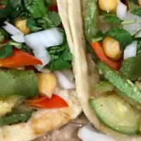 Veggie Taco · (corn or flour) soft tortilla filled with; mix of grilled vegetables and chickpeas .Topped w...