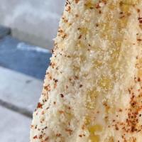 Elotes/Street Corn · Corn on the cob with mayonnaise, cheese, and powdered pequin pepper.