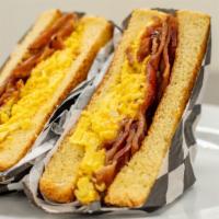 Breakfast Sandwich · choice of meat, eggs and cheese between texas style toast.