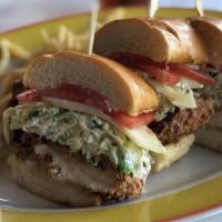 Crispy Chicken · Buttermilk chicken breast, topped with cole slaw, Swiss cheese, tomatoes, and mayonnaise on ...