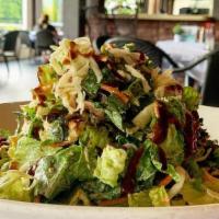 Rotisserie Chicken Salad · Warm, white meat rotisserie chicken, combined with mixed greens, black beans, corn, avocado,...