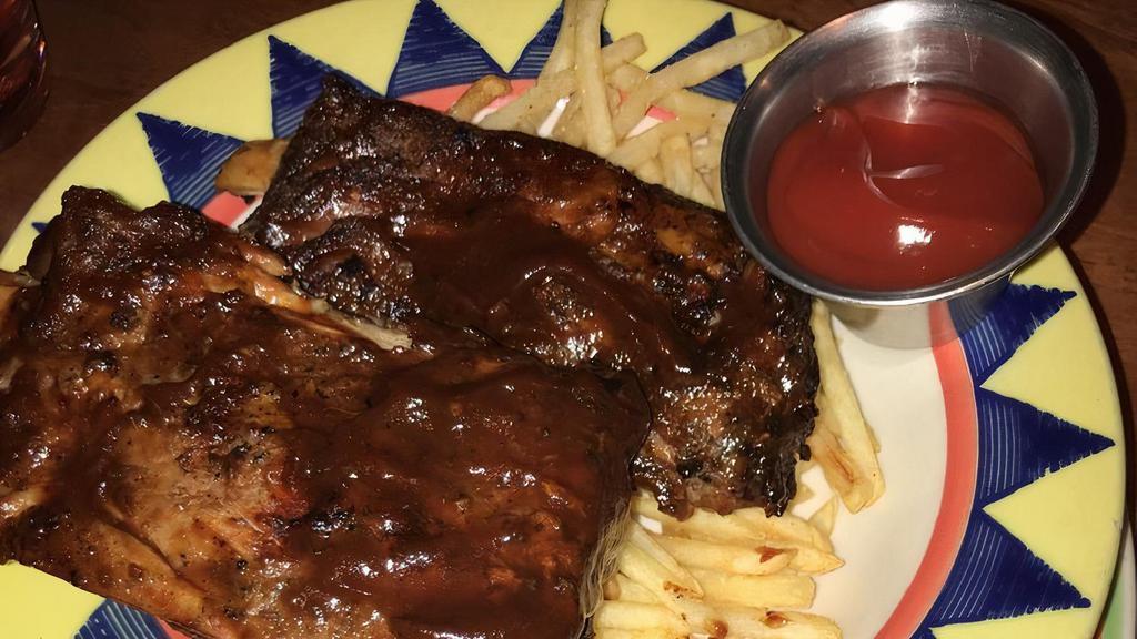 Barbeque Pork Ribs · Slow cooked  ribs topped with BBQ sauce, served with french fried and cole slaw.