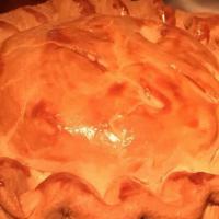 Chicken Pot Pie · Traditional pastry crust filled with rotisserie chicken, carrots, peas, and potatoes.