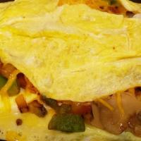 Veggies Omelette · Three eggs, onions, jalapeño, tomatoes, mushrooms, green pepper, cheese.
