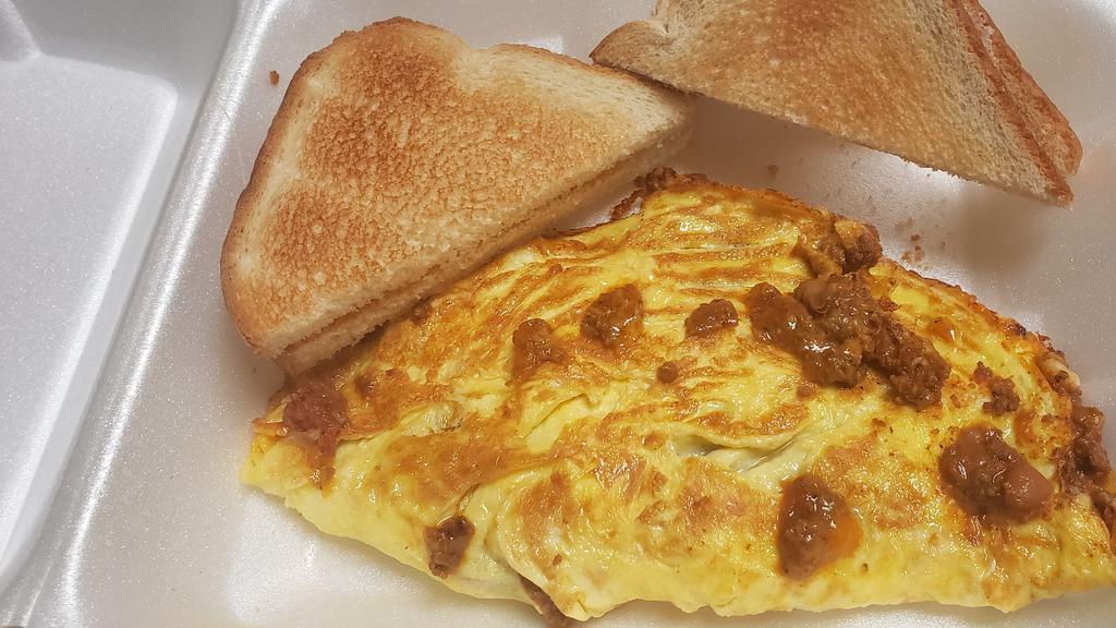 Chili & Cheese Omelette · Three eggs omelette with seasoned chili, beans, cheese, jalapeño omelette with toast and jelly.
