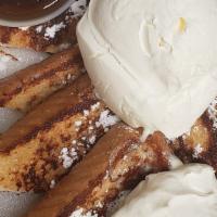 French Toast (2) W/ Whipped Cream · Two slice of French toast cooked and topped with whipped cream, powder sugar and cinnamon po...