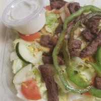 Fajitas Steak Salad · Grilled steak, sliced on lettuce, tomatoes, onions, cheese, choice of dressings.