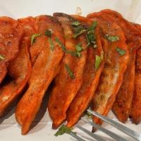 Tandoori Momos · Veg momos marinated with tandoori spices and cooked in clay oven