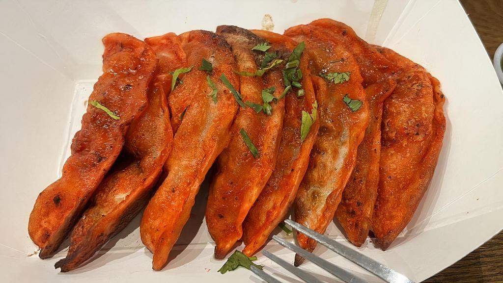 Tandoori Momos · Veg momos marinated with tandoori spices and cooked in clay oven