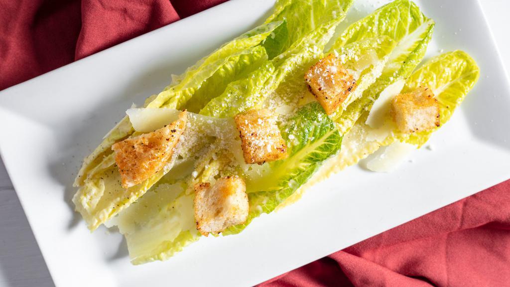 Caesar Salad · Crisp romaine hearts with a pancetta, anchovy dressing, shaved Parmesan cheese & garlic croutons.