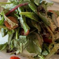 Mixed Green Salad · Mixed greens tossed with a balsamic vinaigrette, cucumbers & tomatoes.