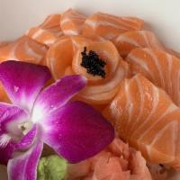 Salmondon · Salmon sashimi served over rice with ginger and wasabi.