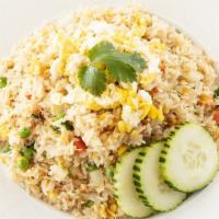 Fried Rice · Hot. Thai style fried rice with egg. Onions, scallions and tomatoes.