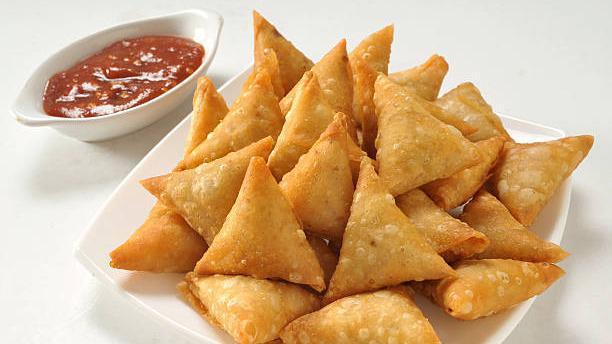 Samosa (2 Pieces) · What's good. Traditional pastries stuffed with potatoes, peas, and light spices.