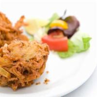 Onion Bhajia · Onions and fried gram flour batter.