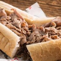Italian Beef Sandwich · Sliced thin and piled high on Italian bread. Served with a side salad or French fries.