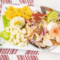 Ceviche Mixto · Seafood and fish marinated in lemon juice with onions, corn and sweet potato.