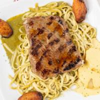 Tallarin Verde Con Bistec · Linguini with basil, spinach and cheese sauce. Served with steak, fried plantain and golden ...