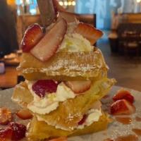 Strawberry Waffle Tower · Our waffle stacked high with macerated strawberries & mascarpone whipped cream.