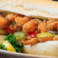 Shrimp Po' Boy · Breaded shrimp fried and served on a roll with creamy coleslaw, pickles, tomatoes and remoul...