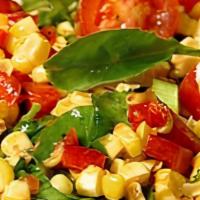 Grilled Corn Salad With Cherry Tomatoes & Arugula (V, Gf) · Grilled corn with cherry tomatoes and arugula and mixed with fresh lemon juice and olive oil.