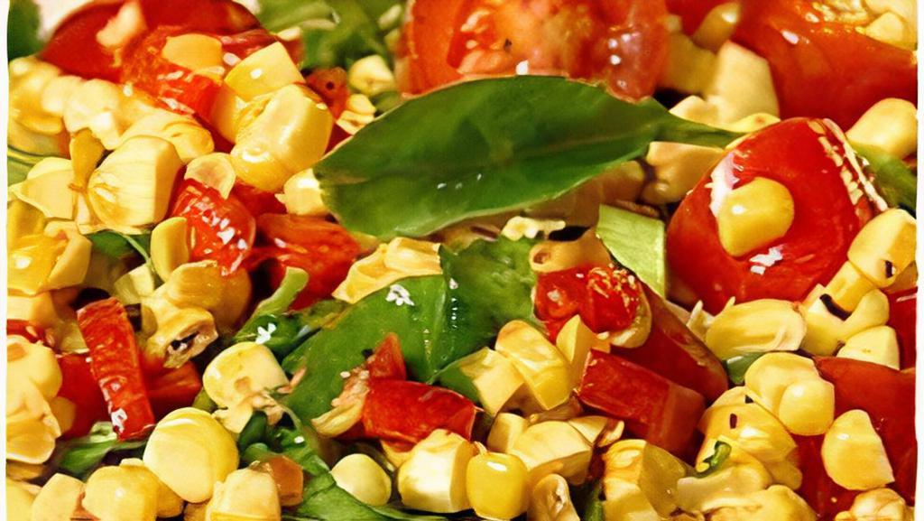 Grilled Corn Salad With Cherry Tomatoes & Arugula (V, Gf) · Grilled corn with cherry tomatoes and arugula and mixed with fresh lemon juice and olive oil.
