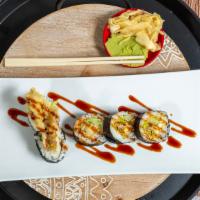 Spider Roll · Raw. In: fried soft shell crab, lettuce, and cucumber. Out: capelin fish roe and eel sauce.