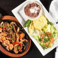 17-Los Toros’ Mixed Fajitas · Delicious beef, chicken and shrimp, in fajita accompanied with fried beans, rice, tortillas ...