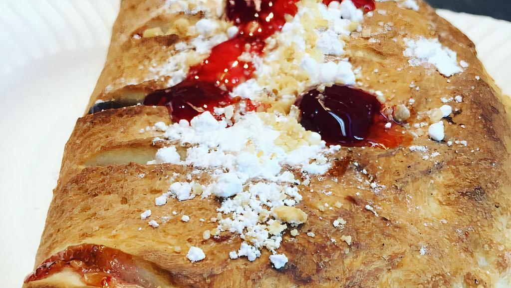 Nutella Strawberry Calzone · With Powder sugar, Mixed Nuts.