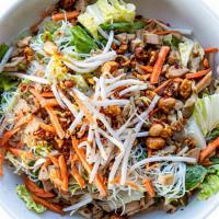 Saigon Chicken · A Vietnamese cold noodle bowl. Rice noodles, romaine lettuce, marinated chicken thigh, cucum...