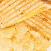 Grilled Cheese · Grilled American cheese on sourdough bread served with kettle cooked chips.